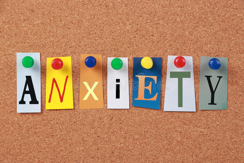 anxiety single word cut out magazine letters pinned to corkboard