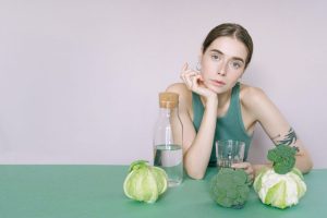 young woman trying to maintain a healthy diet